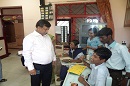 Joint Secretary interacting with a client at Special School