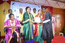 A graduate receiving degree certificate from the Chief Guest