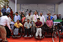 Distribution of tricycles by honourable dignitaries