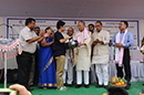 Shri.O. Ibobi Singh, Hon'ble Chief Minister of Manipur, distributing C.D player to one of the beneficiaries