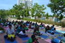  Children with Differently abled along with Parents Performing Yoga.