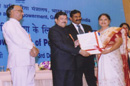 Dr. Neeradha Chandramohan(Director - N.I.E.P.M.D) receiving the award from Honorable Minister Shri. Mukul Wasnik, MSJ&E, GOI