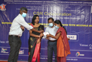 Dr.A.Amarnath, Deputy Registrar (Offg),giving Scholarship to the student under CSR initiative of United Way,Chennai